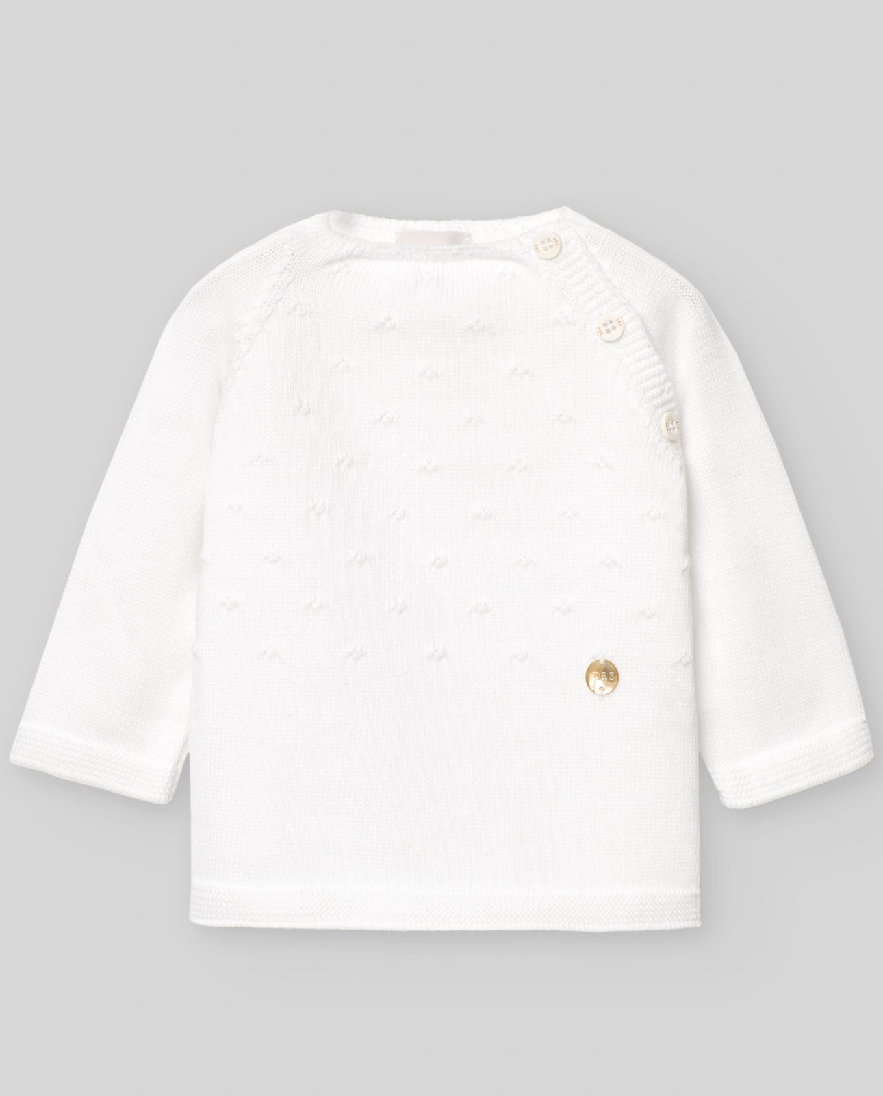 Conjunto blanco con gorro de la marca Paz Rodriguez