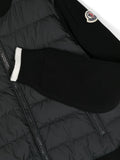 Black puffer jacket with MONCLER brand panels