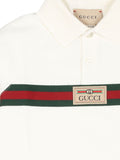 Polo blanco con logo estampado de la marca Gucci kids