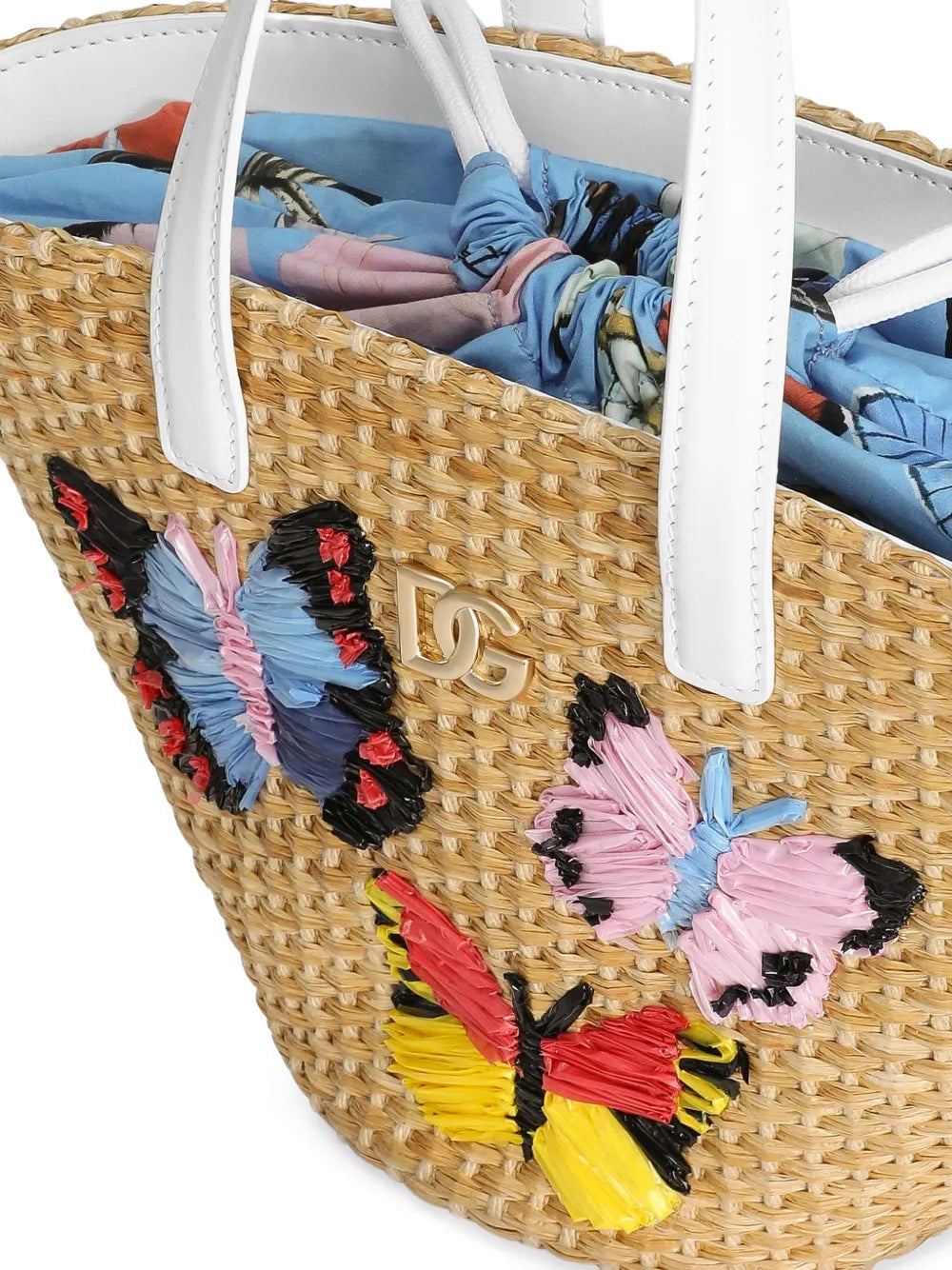 Bolso con logotipo DG metálico y mariposas bordadas en rafia para niña