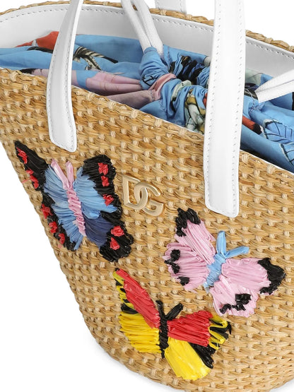 Bolso con logotipo DG metálico y mariposas bordadas en rafia para niña