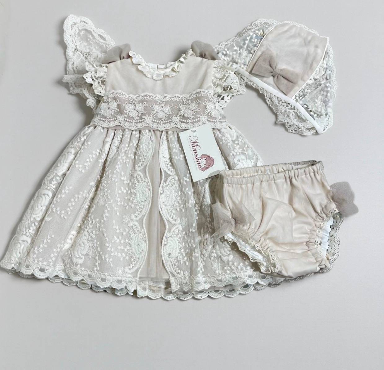 Ecru and pink lace dress 3022 with brag and cap for christening of the brand MIMOSINES